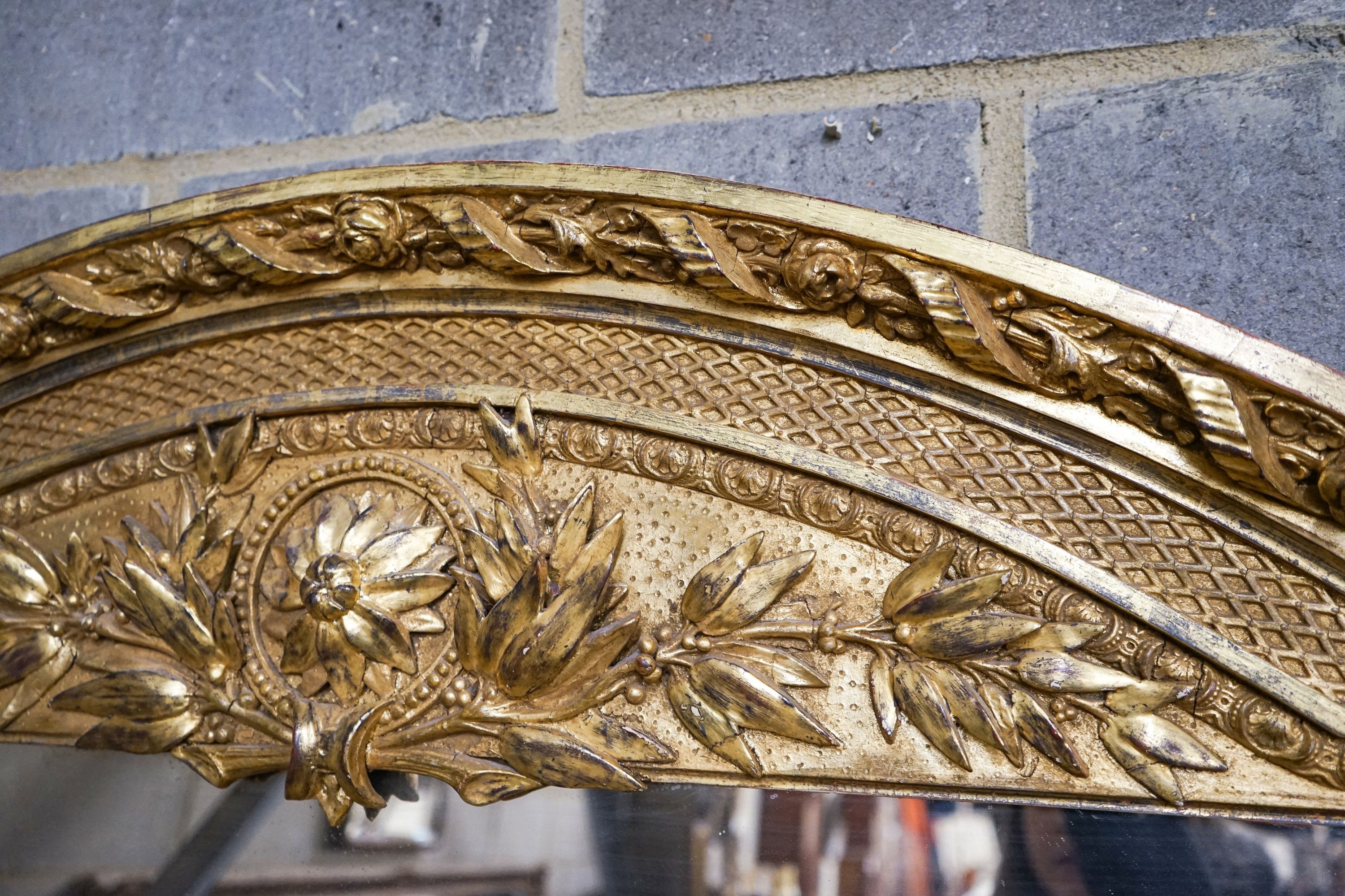 A Victorian carved giltwood and gesso overmantel mirror, the plate flanked by fluted columns, width 155cm, height 178cm